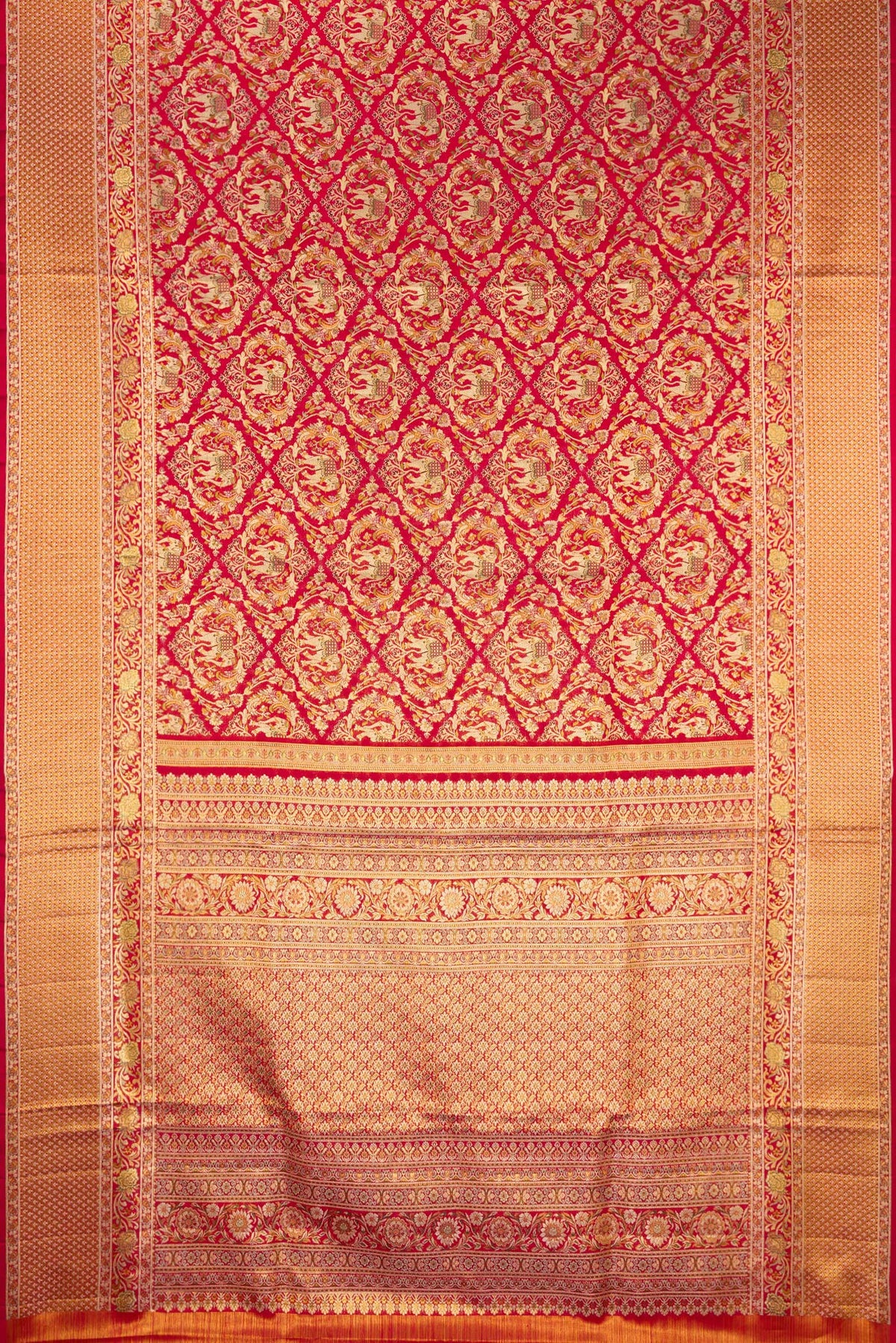 Flat view of Deep Red Dual Tone Kanchipuram Tissue Saree with Zari Brocade on the body and Fancy Border. 