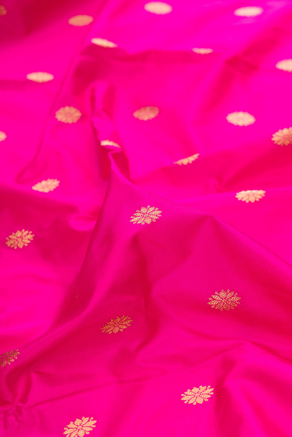 Close up of Pure Silk Pink Paithani Saree with Zari Butta on the body and Paithani Border.  displaying folds