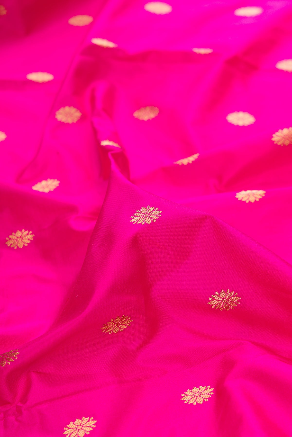 Close up of Pure Silk Pink Paithani Saree with Zari Butta on the body and Paithani Border.  displaying folds