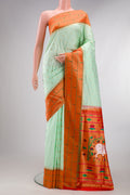 Pure Silk Light Green Paithani Saree with Zari Butta on the body and Paithani Border.  displayed on a mannequin
