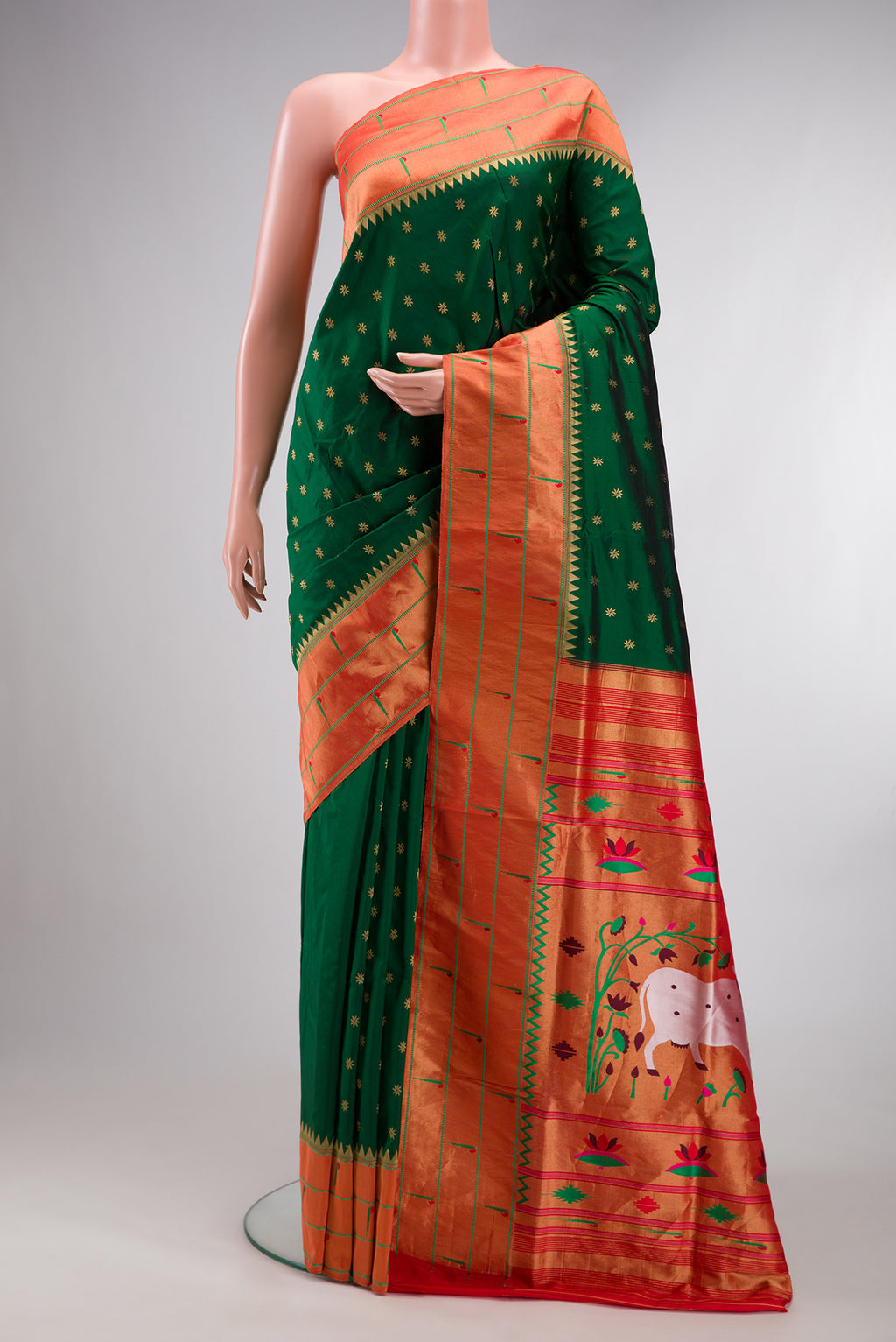 Pure Silk Bottle Green Paithani Saree with Zari Butta on the body and Paithani Border.  displayed on a mannequin