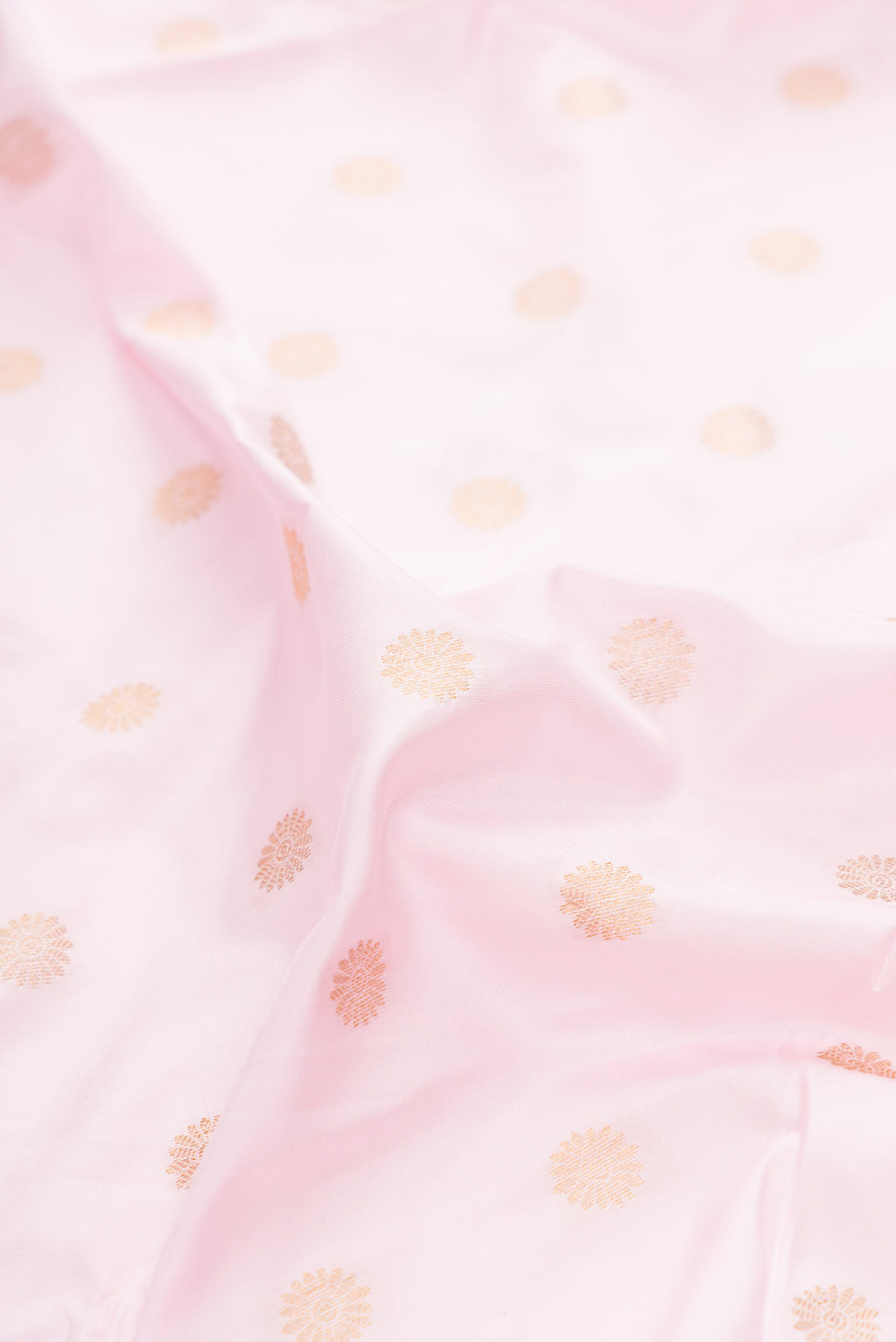Close up of Pure Silk Rose pink Paithani Saree with Zari Butta on the body and Paithani Border.  displaying folds