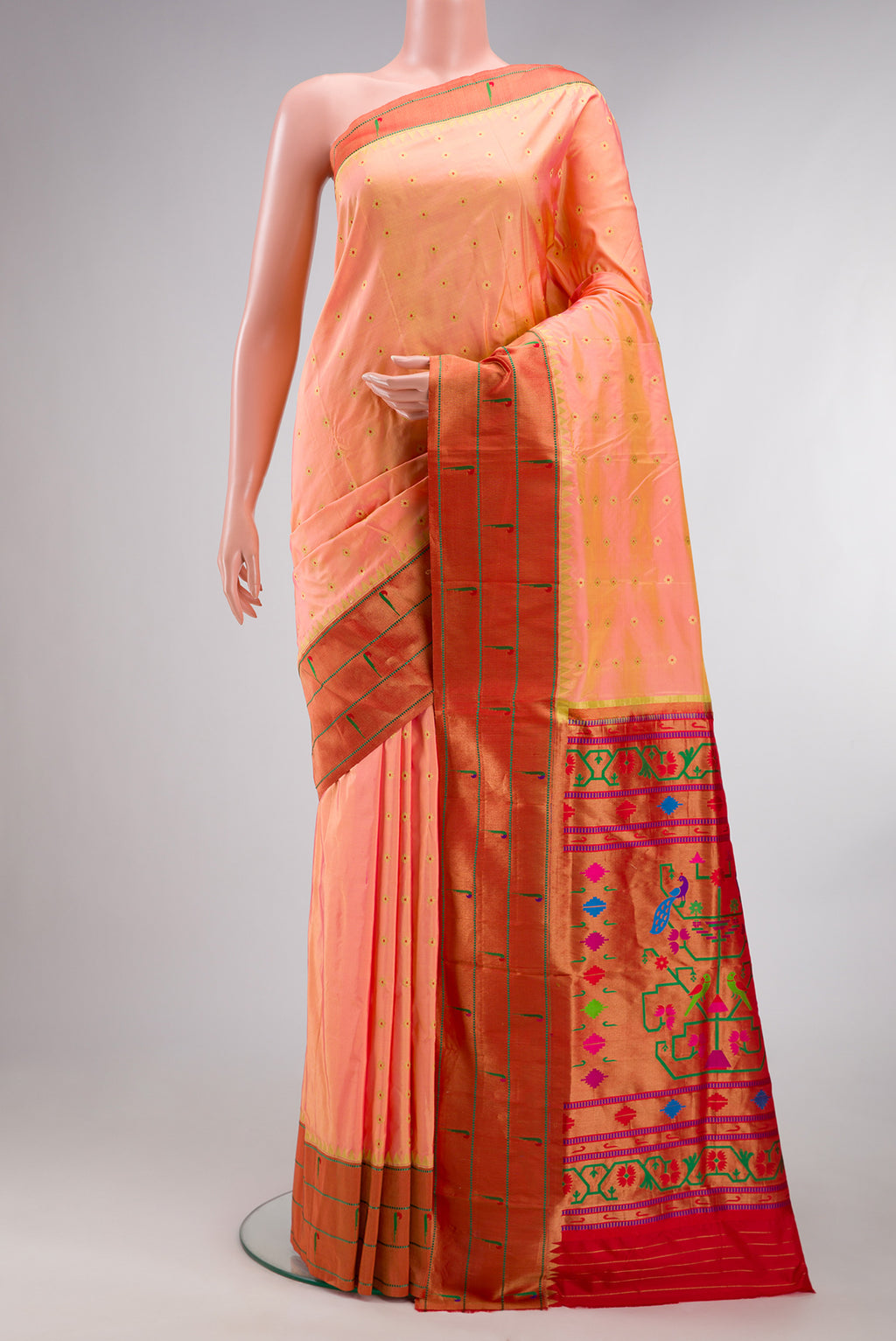 Pure Silk Peach Dual Tone Paithani Saree with Zari Butta on the body and Paithani Border.  displayed on a mannequin