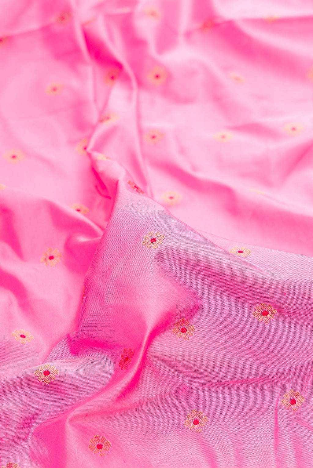 Close up of Pure Silk Rose pink Paithani Saree with Zari And Thread Butta on the body and Paithani Border.  displaying folds