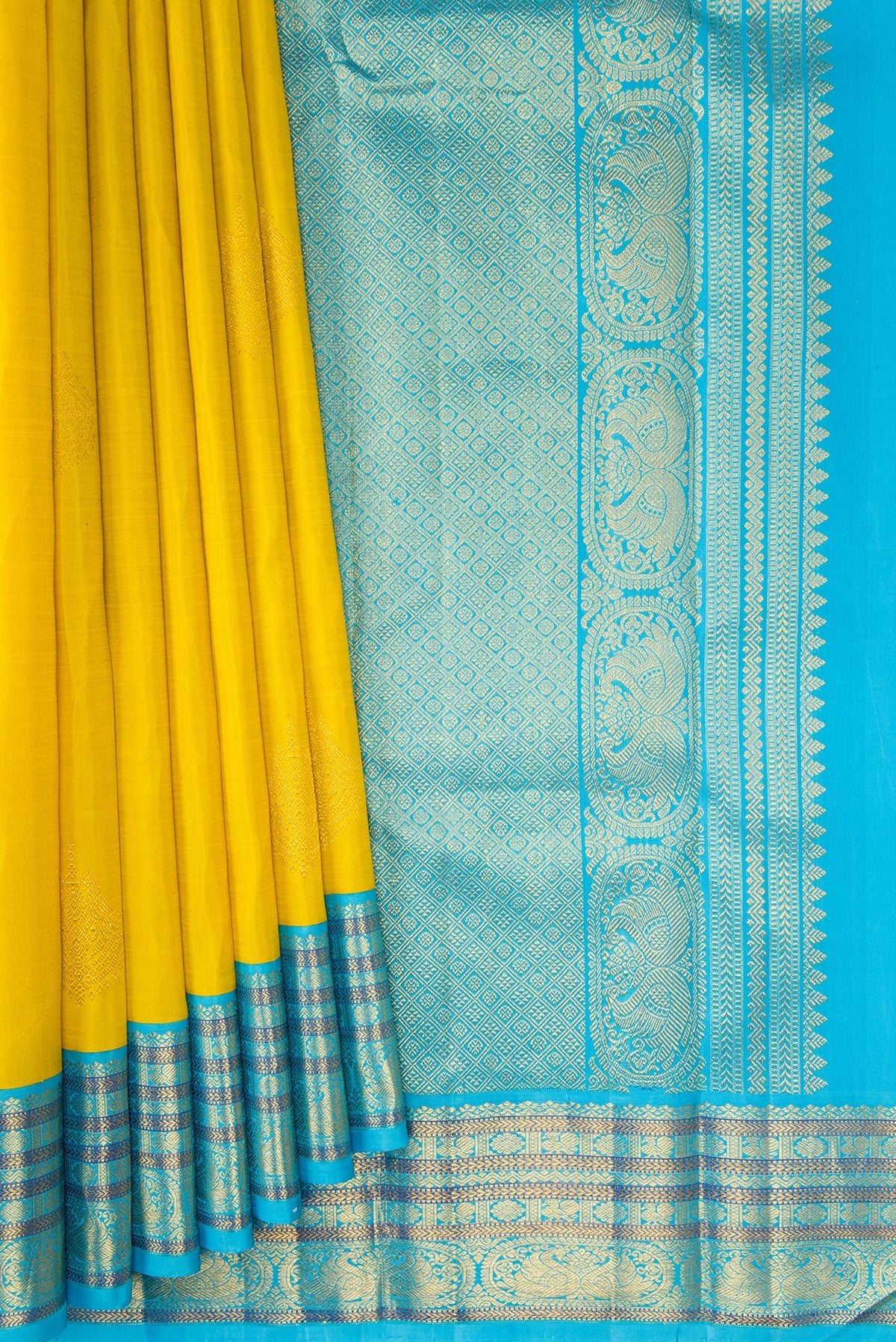 Pleats and pallu of Pure Silk Yellow Kanjivaram Saree with Zari Butta on the body and Zari Border. 