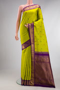 Pure Silk Green Dual Tone Kanjivaram Saree with Thread Butta on the body and Zari Border.  displayed on a mannequin