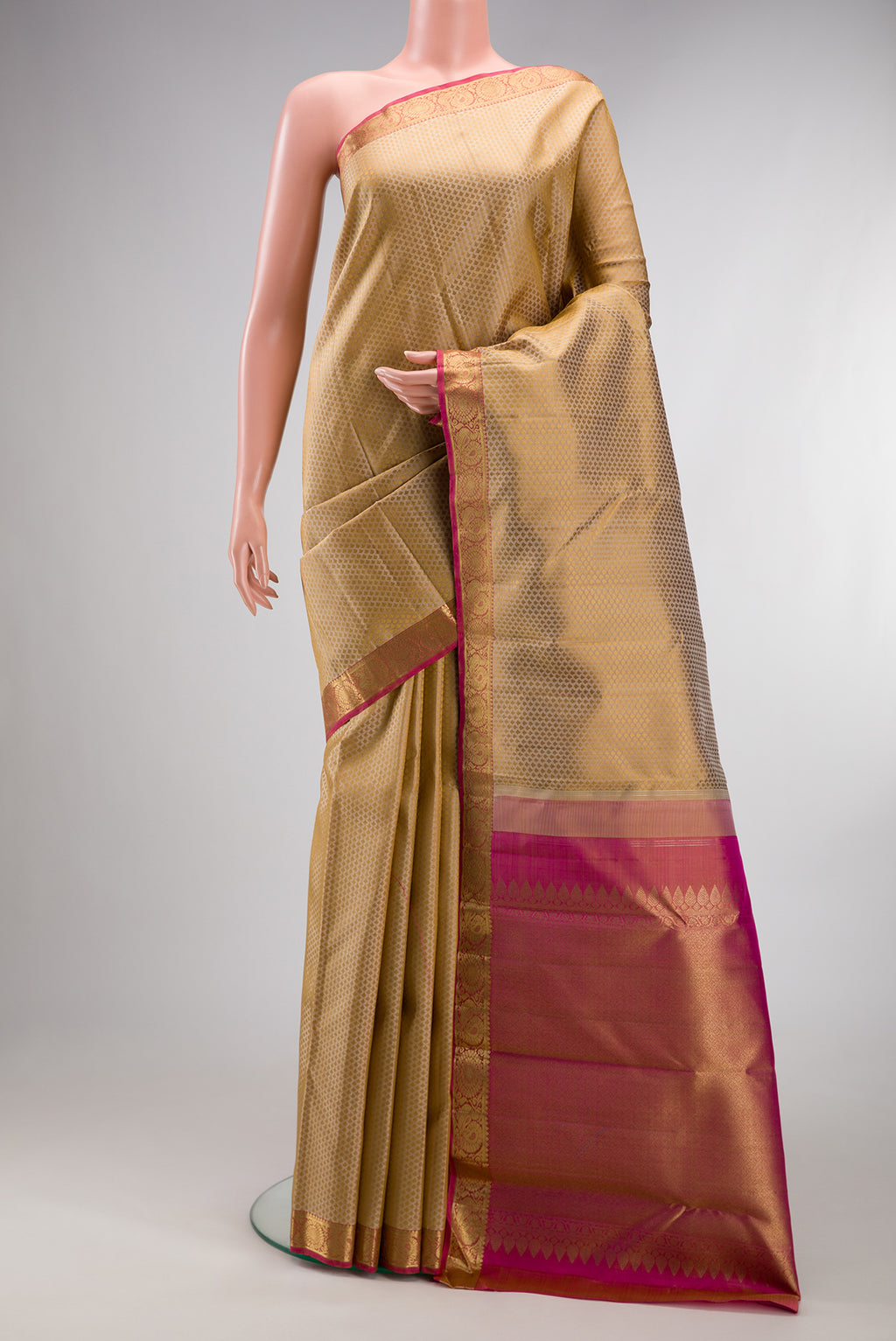 Pure Silk Pure Zari Beige Kanchipuram Saree with Jacquard design on the body and Zari Border.  displayed on a mannequin