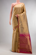 Pure Silk Pure Zari Beige Kanchipuram Saree with Jacquard design on the body and Zari Border.  displayed on a mannequin