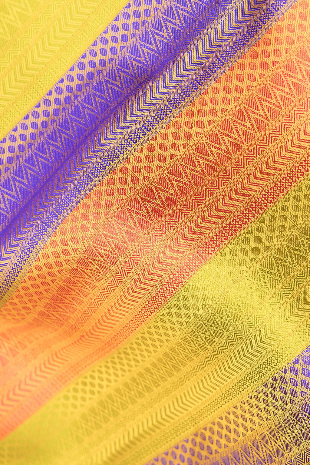 Close up of Pure Silk Multi Color Kanchipuram Saree with Jacquard design on the body and Zari Border.  displaying folds
