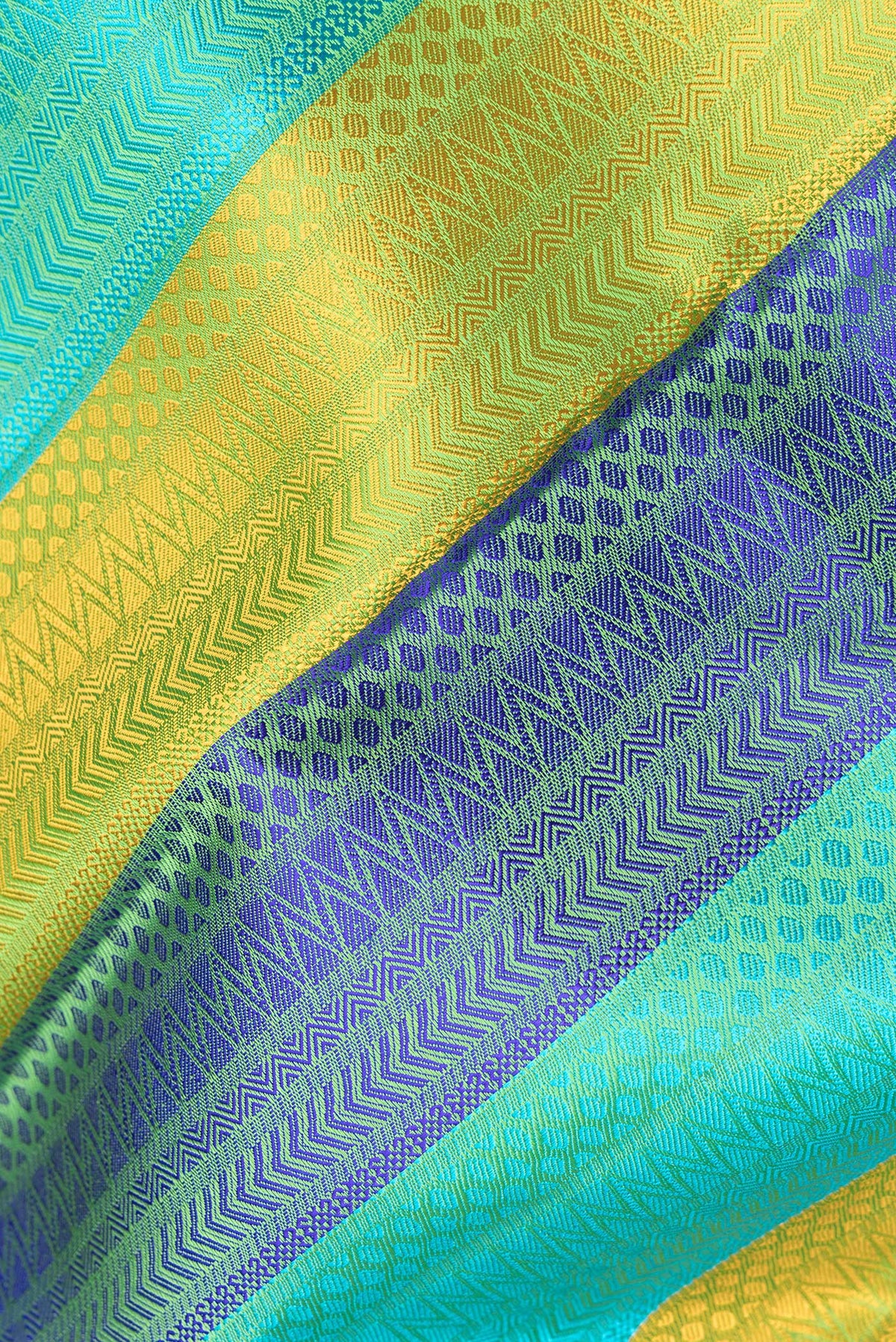 Close up of Pure Silk Multi Color Kanchipuram Saree with Jacquard design on the body and Zari Border.  displaying folds