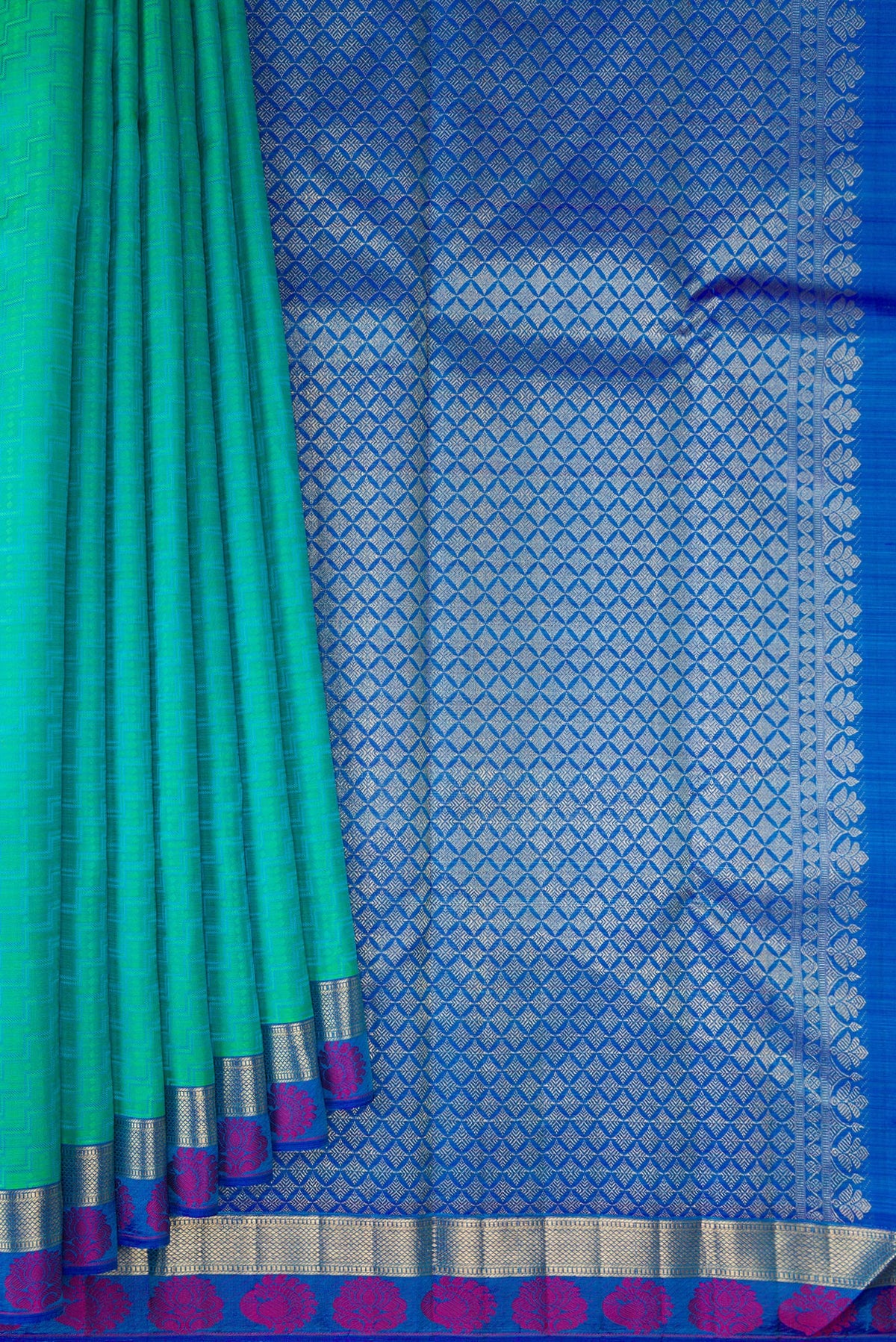 Pleats and pallu of Pure Silk Sea Green Kanchipuram Saree with Jacquard design on the body and Fancy Border. 