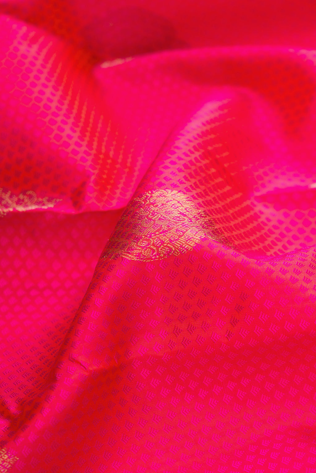 Close up of Pure Silk Pink Kanchipuram Saree with Jacquard design on the body and Fancy Border.  displaying folds