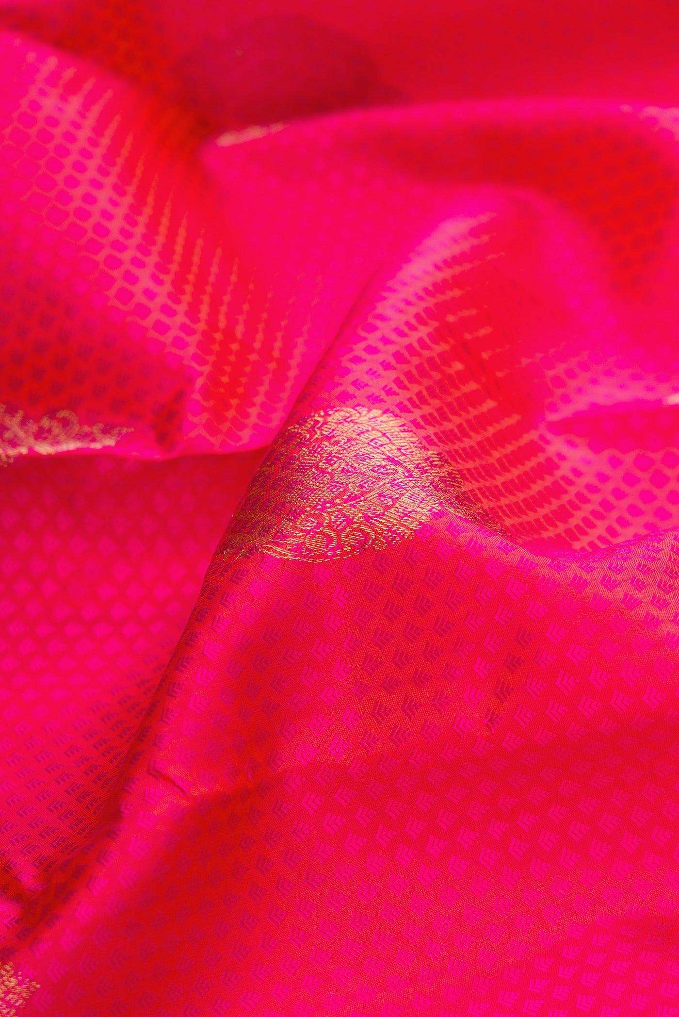 Close up of Pure Silk Pink Kanchipuram Saree with Jacquard design on the body and Fancy Border.  displaying folds