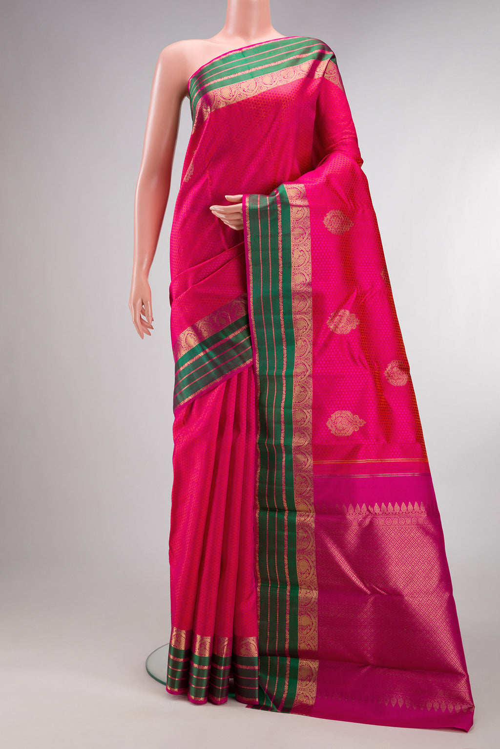 Pure Silk Pink Kanchipuram Saree with Jacquard design on the body and Fancy Border.  displayed on a mannequin