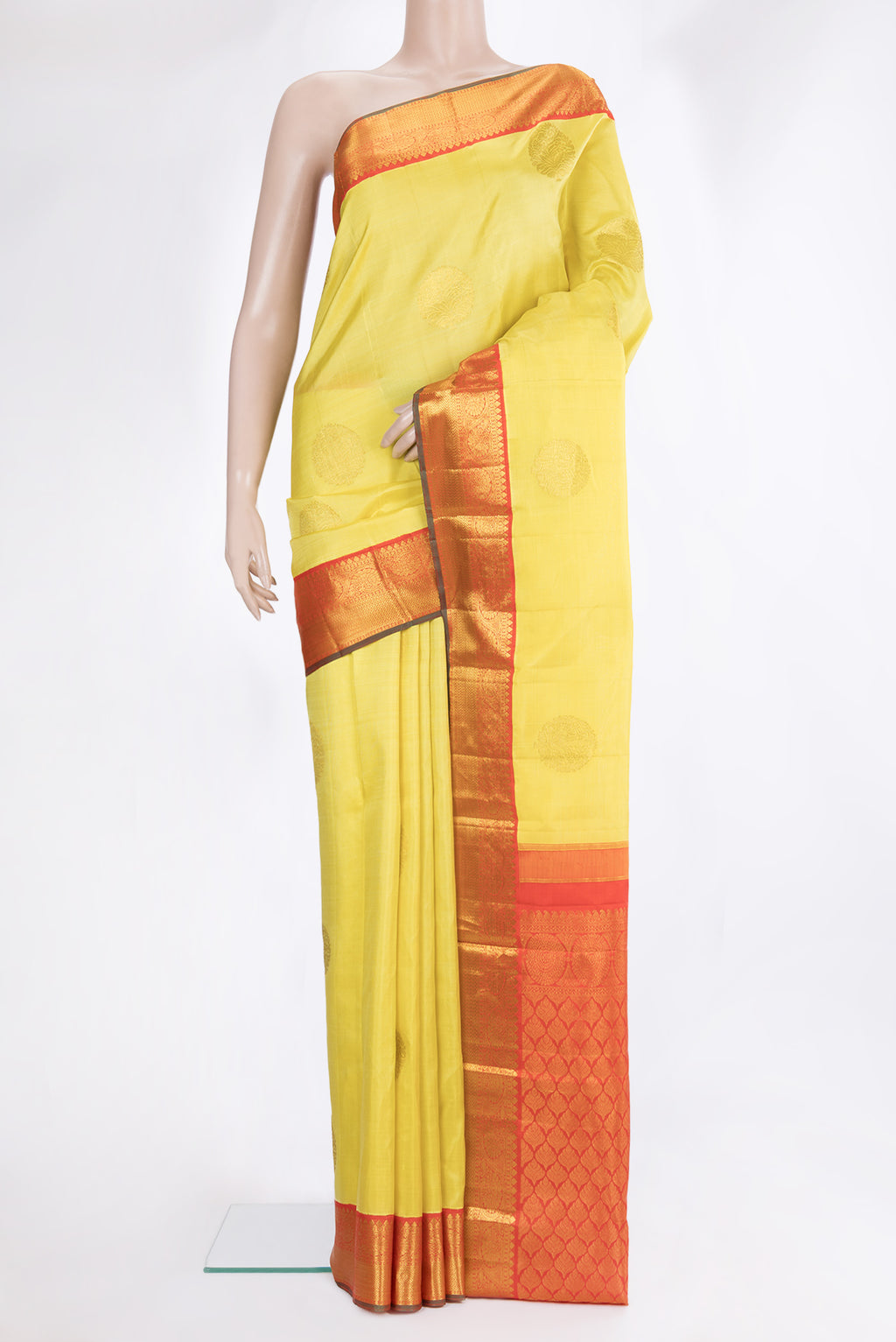 Pure Silk Yellow Kanjivaram Saree with Zari Butta on the body and Zari Border.  displayed on a mannequin