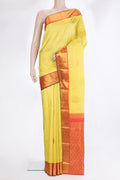 Pure Silk Yellow Kanjivaram Saree with Zari Butta on the body and Zari Border.  displayed on a mannequin