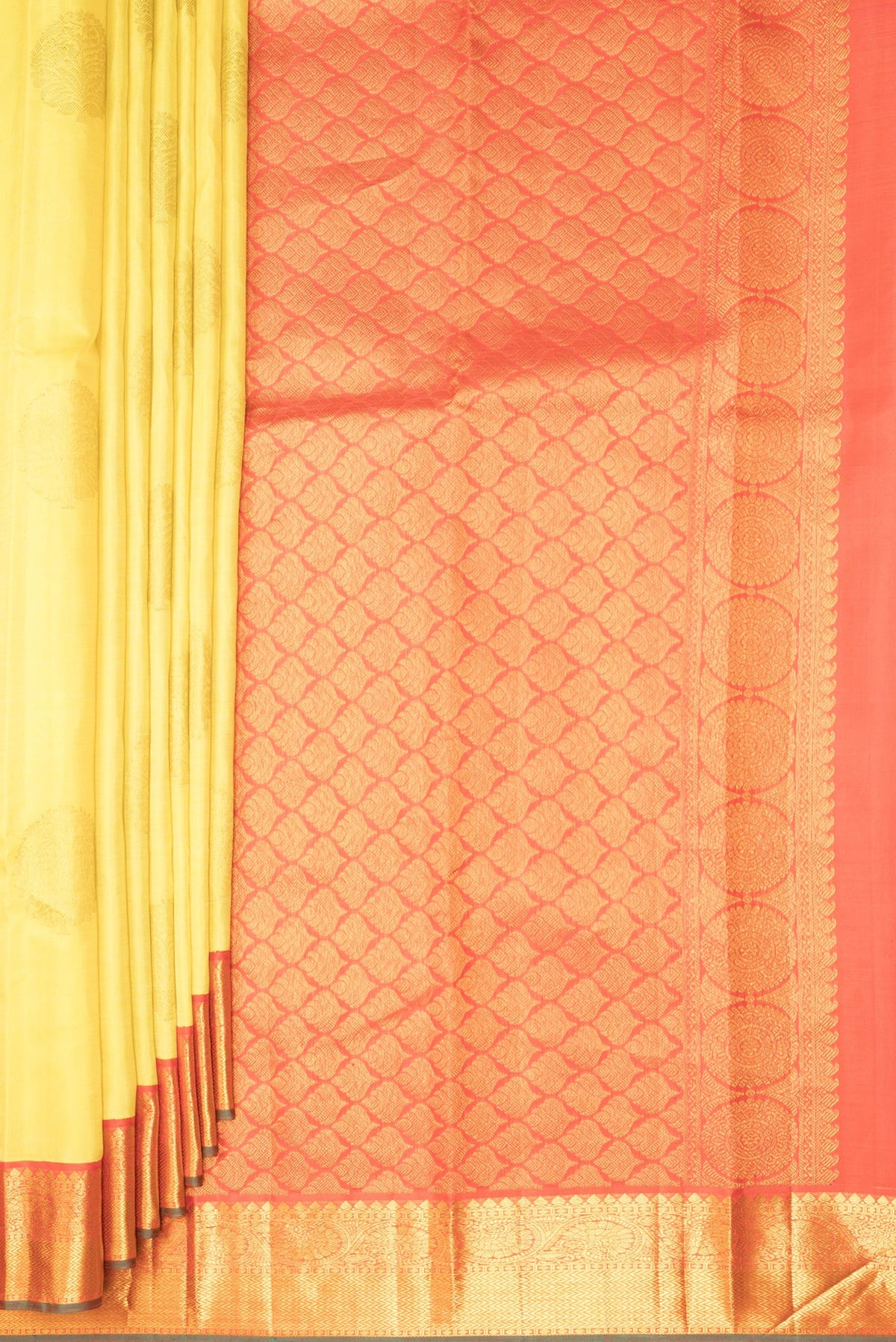 Pleats and pallu of Pure Silk Yellow Kanjivaram Saree with Zari Butta on the body and Zari Border. 