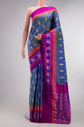 Pure Silk Maya Blue Dual Tone Pochampally Saree with Ikat design on the body and Ikat Border.  displayed on a mannequin
