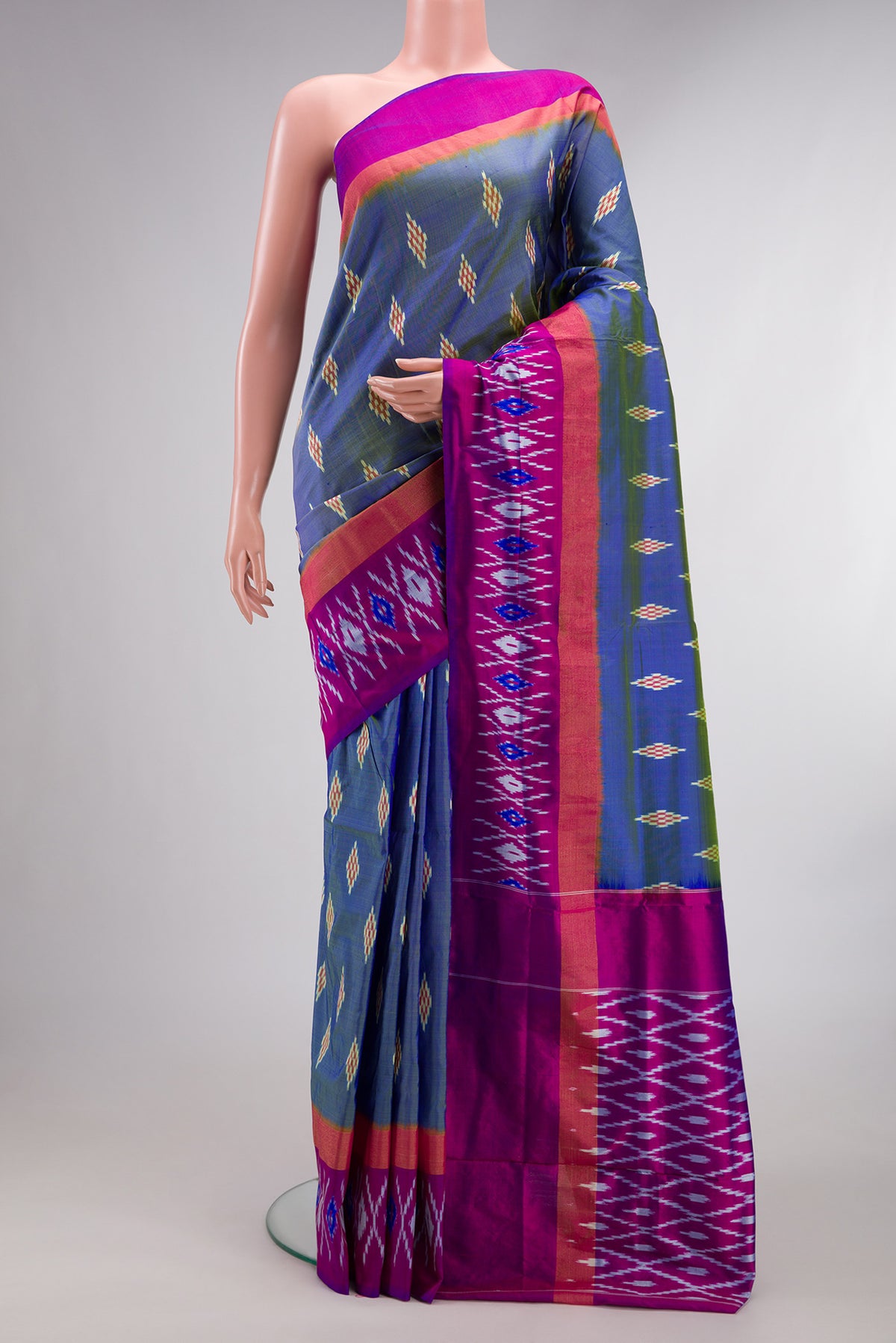 Pure Silk Maya Blue Dual Tone Pochampally Saree with Ikat design on the body and Ikat Border.  displayed on a mannequin