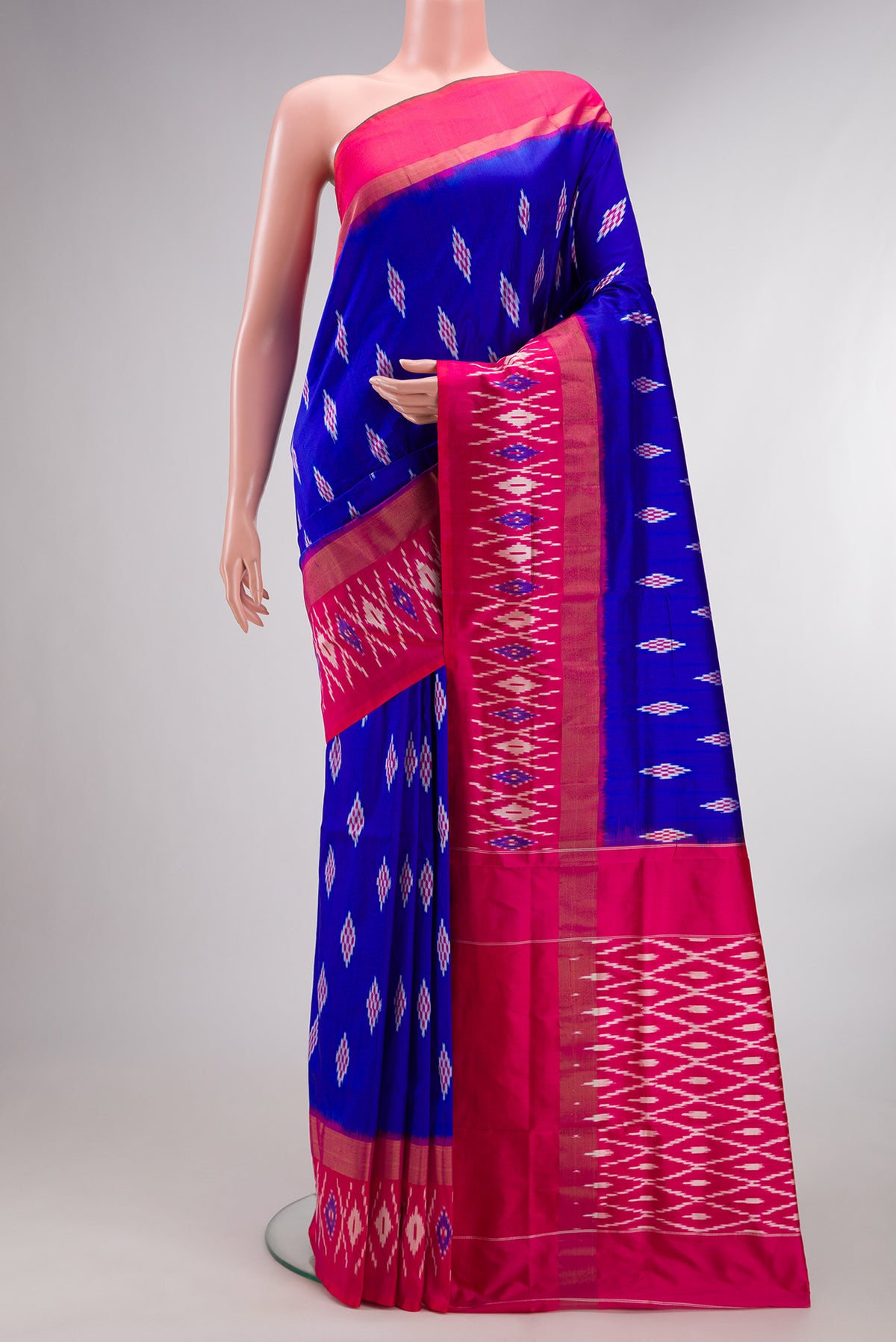 Pure Silk Royal Blue Dual Tone Pochampally Saree with Ikat design on the body and Ikat Border.  displayed on a mannequin