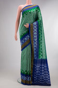 Pure Silk Green Pochampally Saree with Ikat design on the body and Ikat Border.  displayed on a mannequin