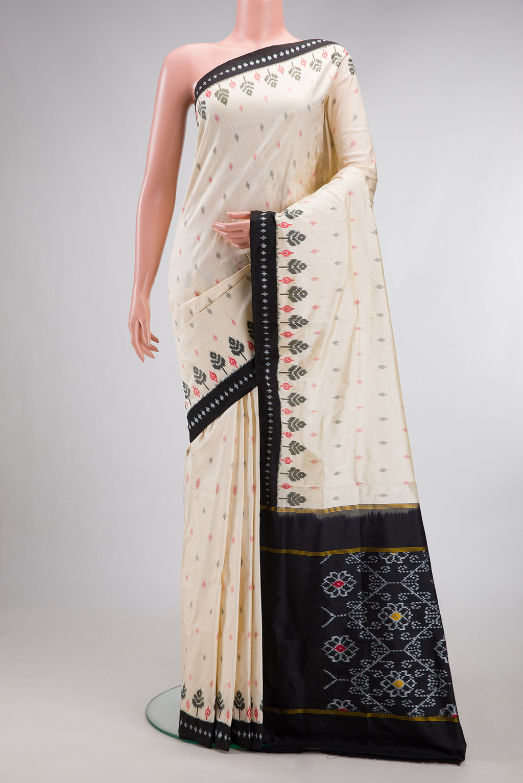 Pure Silk Off White Pochampally Saree with Pure Ikat on the body and Ikat Border.  displayed on a mannequin