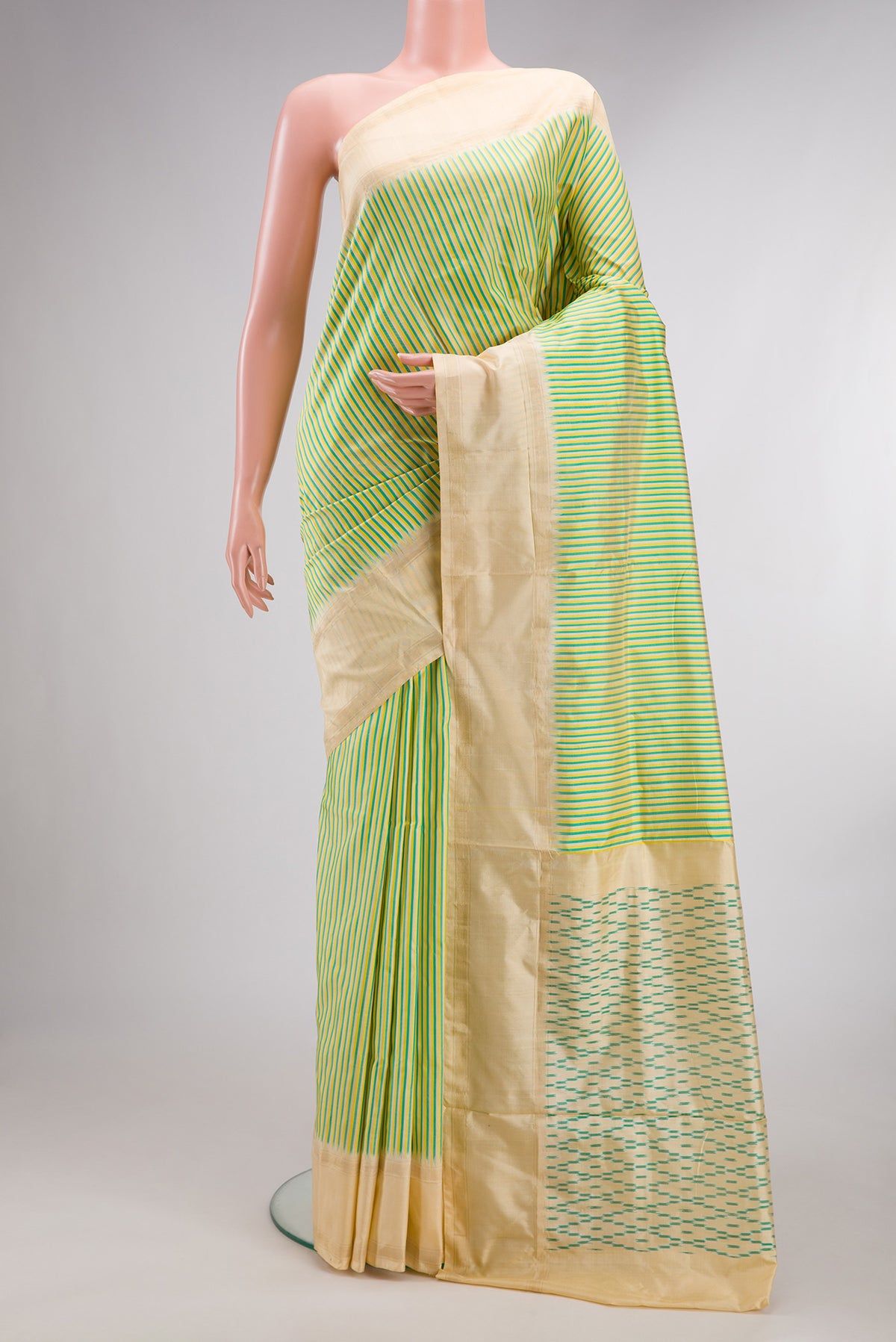 Pure Silk Multi Color Pochampally Saree with Stripes on the body and Zari Border.  displayed on a mannequin