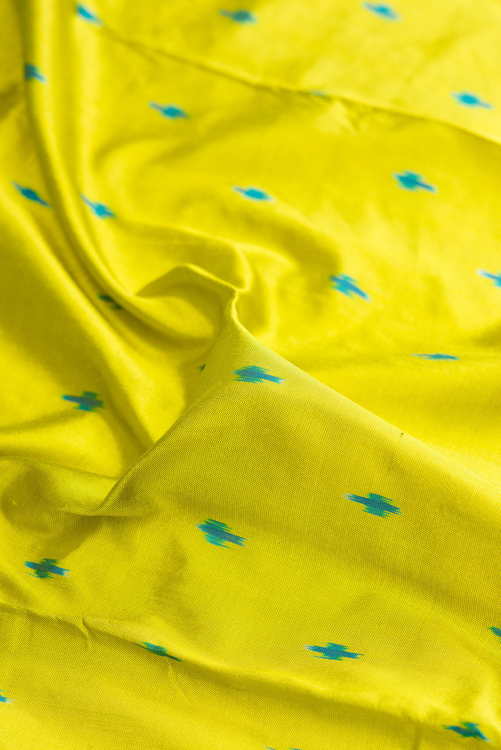 Close up of Pure Silk Parrot Green Pochampally Saree with Pure Ikat on the body and Ikat Border.  displaying folds