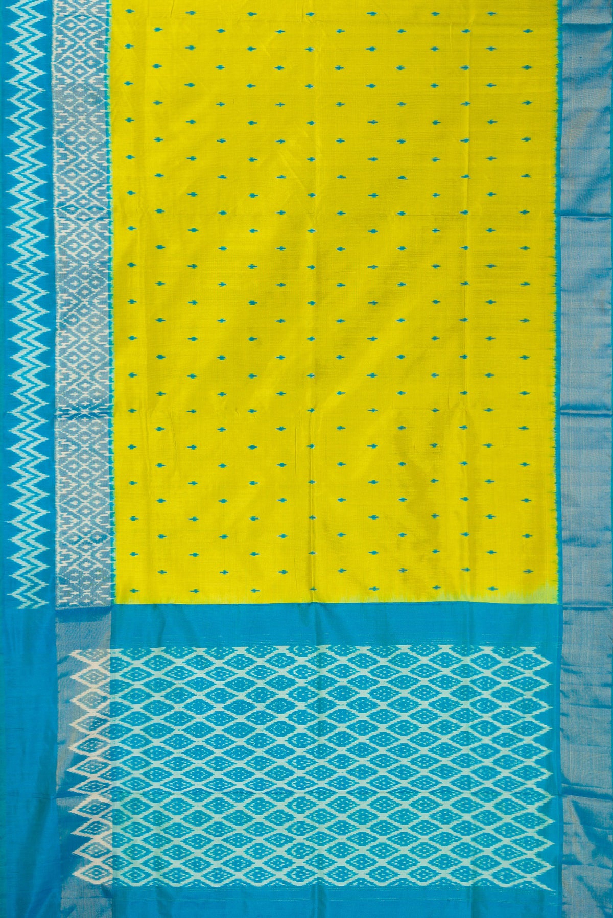 Flat view of Pure Silk Parrot Green Pochampally Saree with Pure Ikat on the body and Ikat Border. 