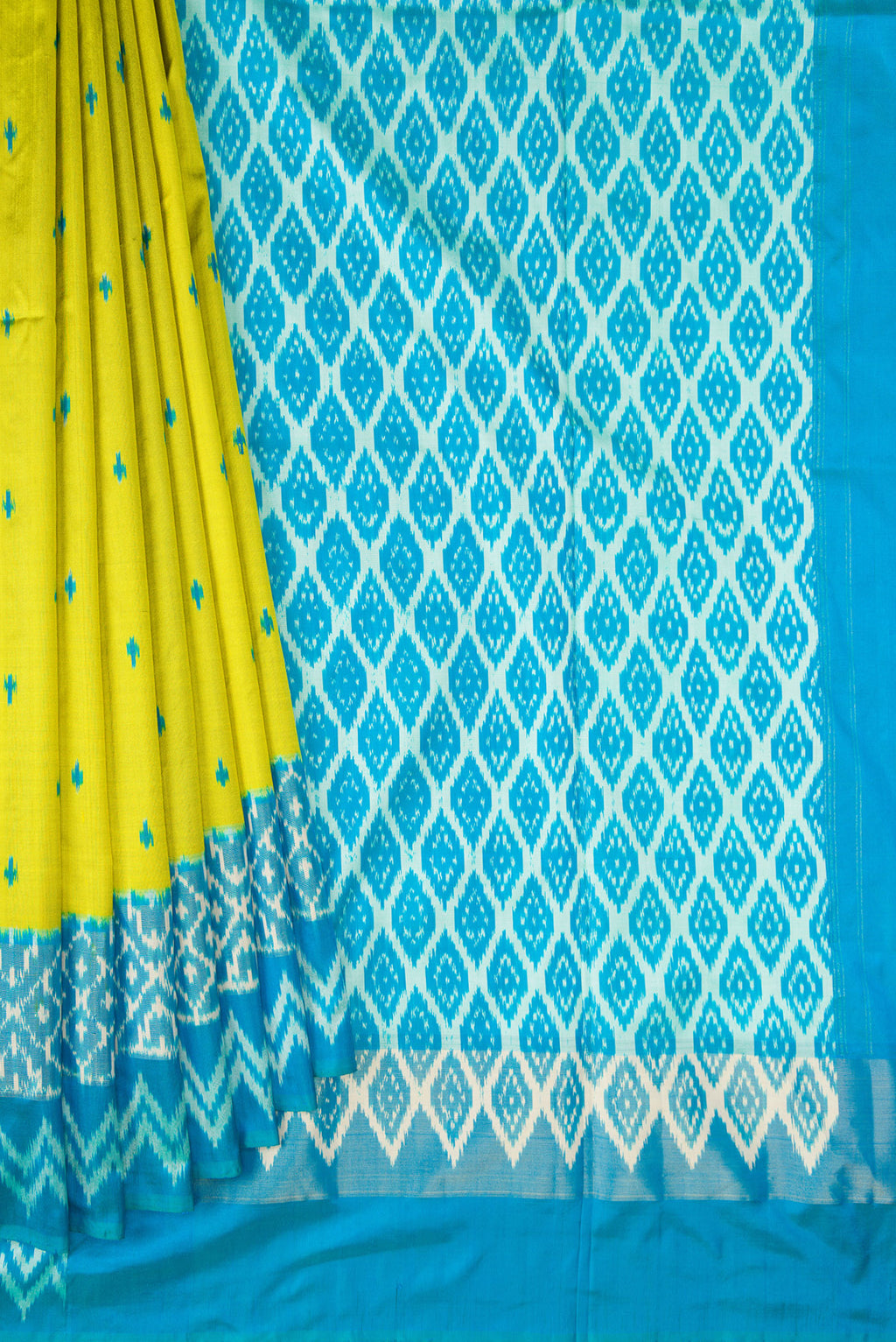 Pleats and pallu of Pure Silk Parrot Green Pochampally Saree with Pure Ikat on the body and Ikat Border. 