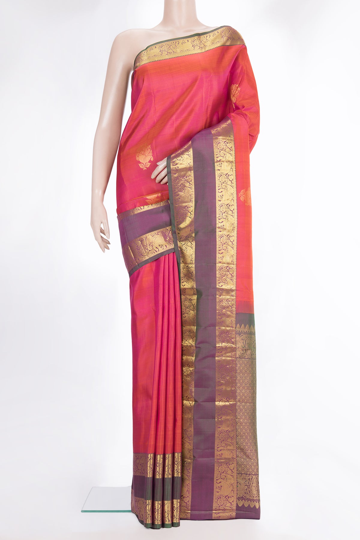 Pure Silk Orange Dual Tone Kanchipuram Saree with Zari Butta on the body and Zari Border.  displayed on a mannequin