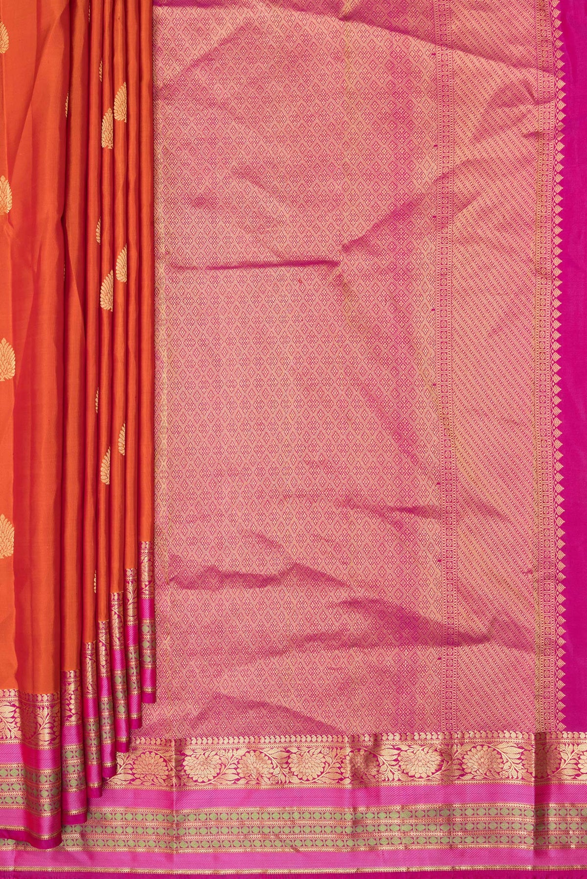 Pleats and pallu of Pure Silk Orange Kanjivaram Saree with Zari Butta on the body and Zari And Thread Border. 