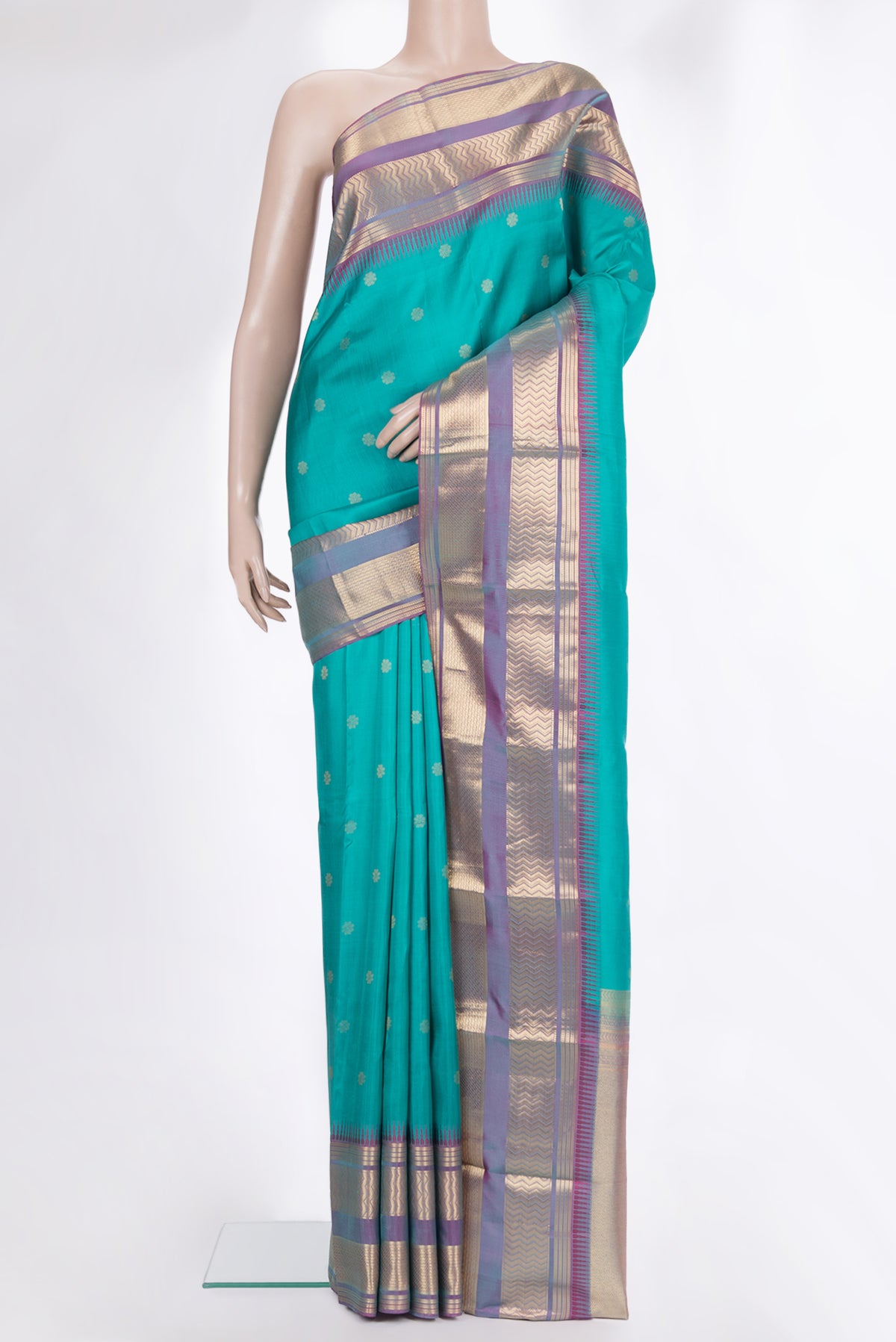 Pure Silk Turquoise Dual Tone Kanjivaram Saree with Zari Butta on the body and Fancy Border.  displayed on a mannequin