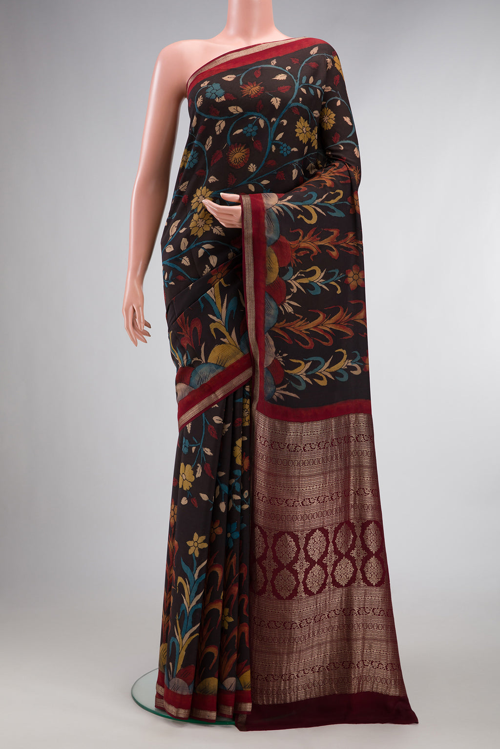 Brown Mysore Chiffon Saree with kalamkari Print on the body and Zari Border.  displayed on a mannequin