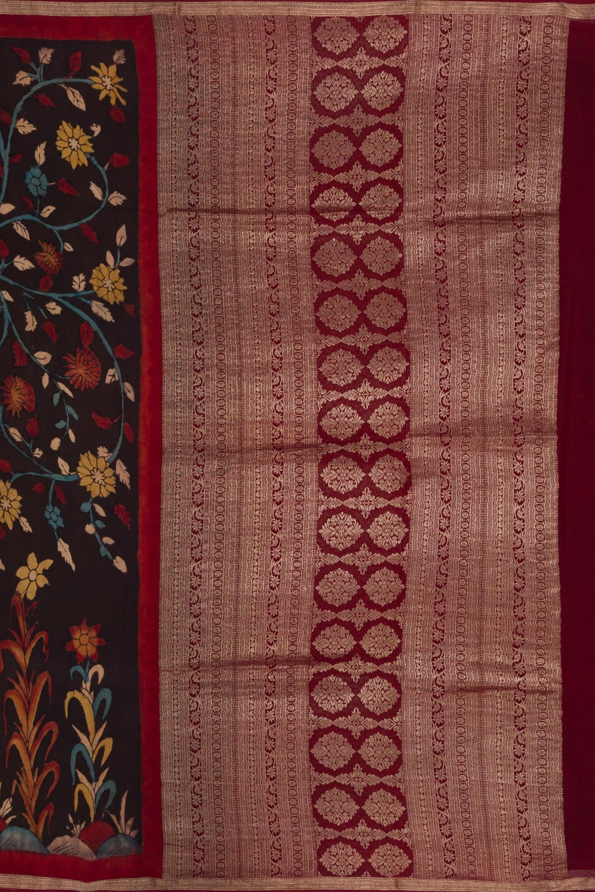 Close up image of the pallu of Brown Mysore Chiffon Saree with kalamkari Print on the body and Zari Border. 