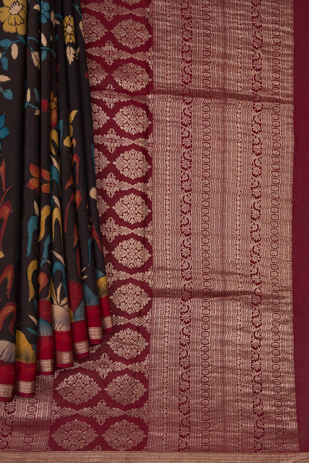 Pleats and pallu of Brown Mysore Chiffon Saree with kalamkari Print on the body and Zari Border. 