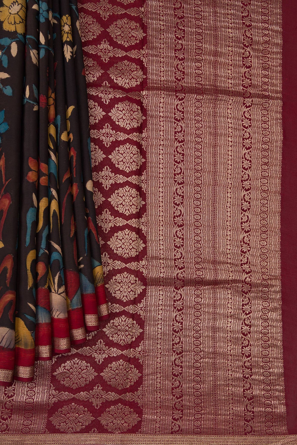 Pleats and pallu of Brown Mysore Chiffon Saree with kalamkari Print on the body and Zari Border. 