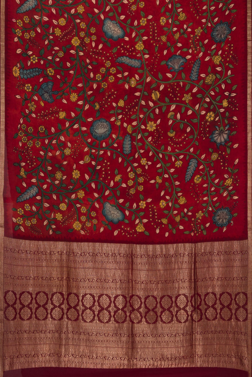 Flat view of Deep Red Mysore Chiffon Saree with kalamkari Print on the body and Zari Border. 