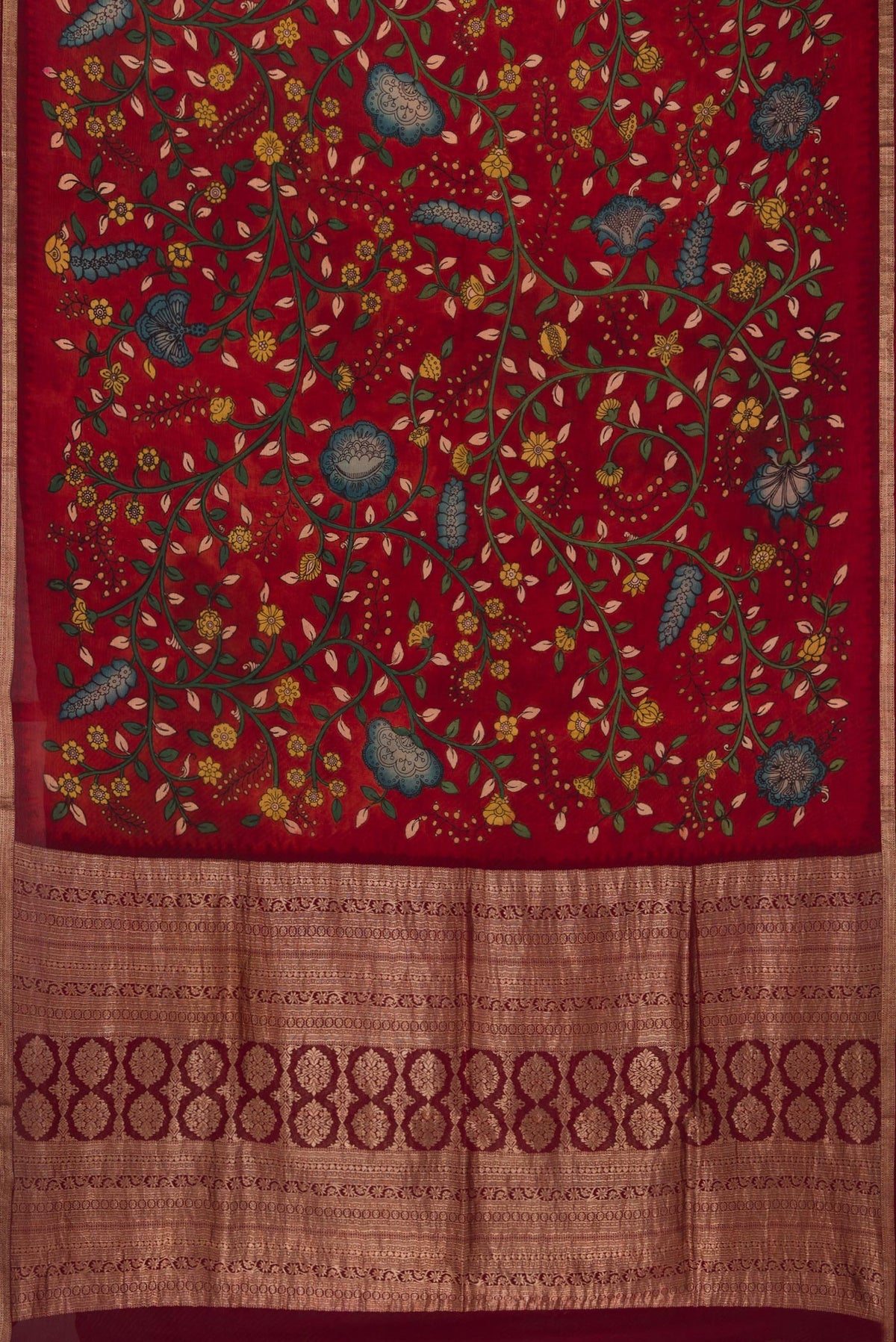 Flat view of Deep Red Mysore Chiffon Saree with kalamkari Print on the body and Zari Border. 