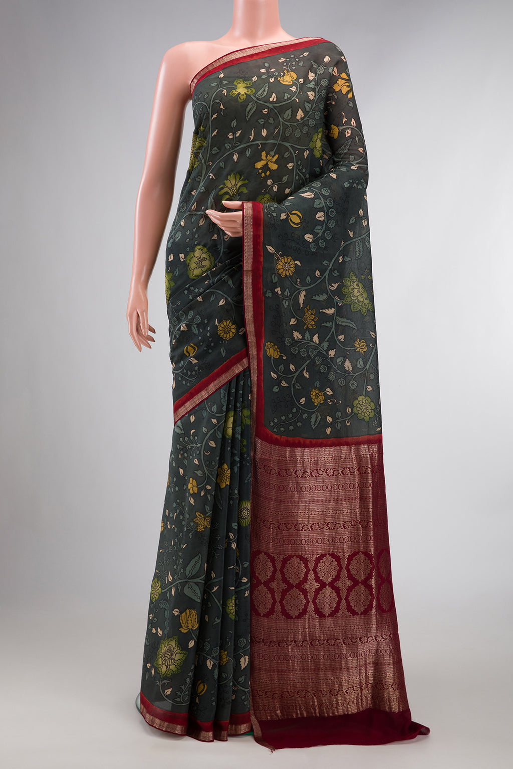 Grey Mysore Chiffon Saree with kalamkari Print on the body and Zari Border.  displayed on a mannequin