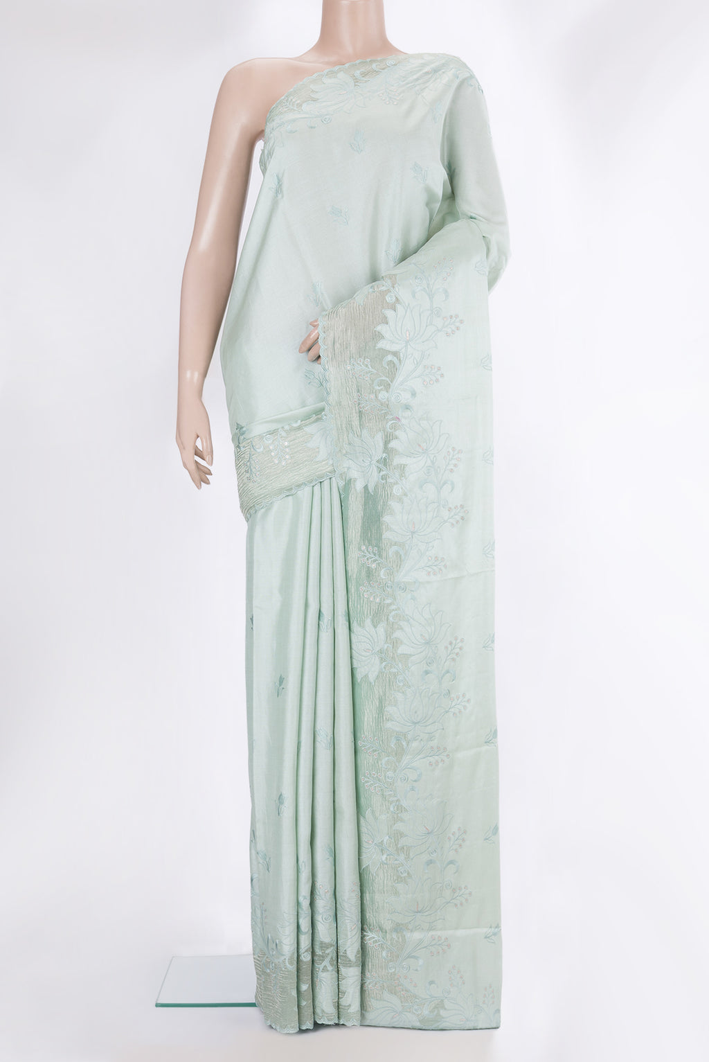 Pure Silk Mint Green Dual Tone Tussar Saree with Embroidery on the body and Embroidery Border.  displayed on a mannequin
