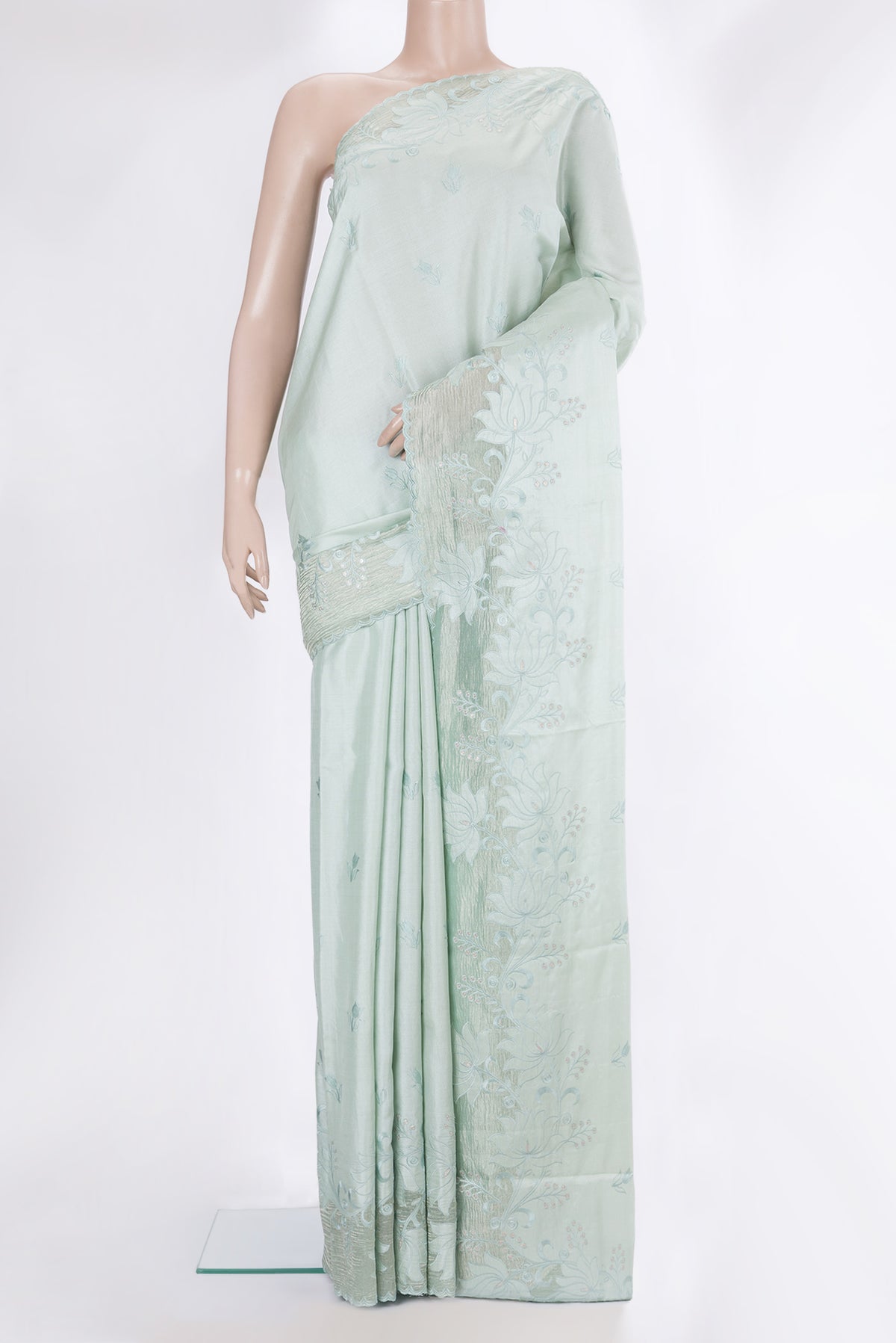 Pure Silk Mint Green Dual Tone Tussar Saree with Embroidery on the body and Embroidery Border.  displayed on a mannequin