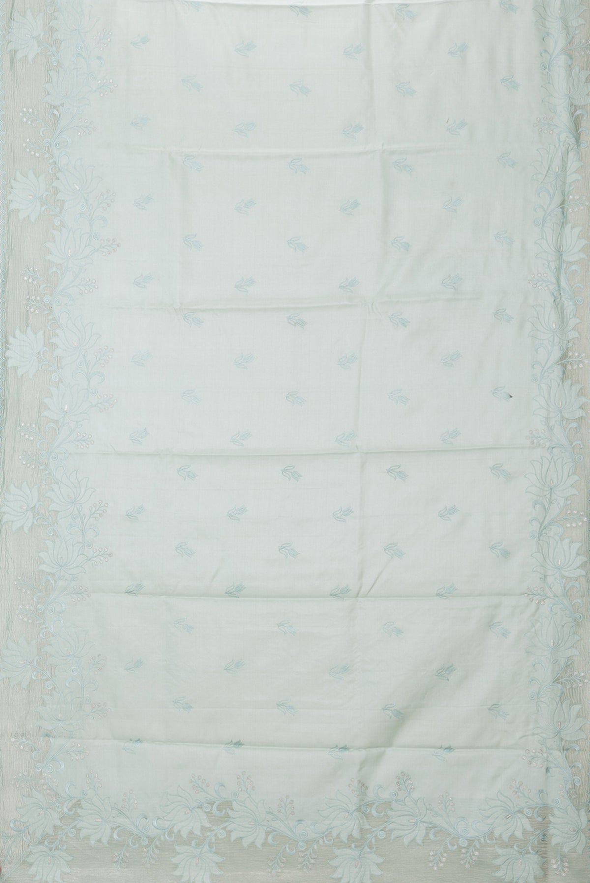 Flat view of Pure Silk Mint Green Dual Tone Tussar Saree with Embroidery on the body and Embroidery Border. 