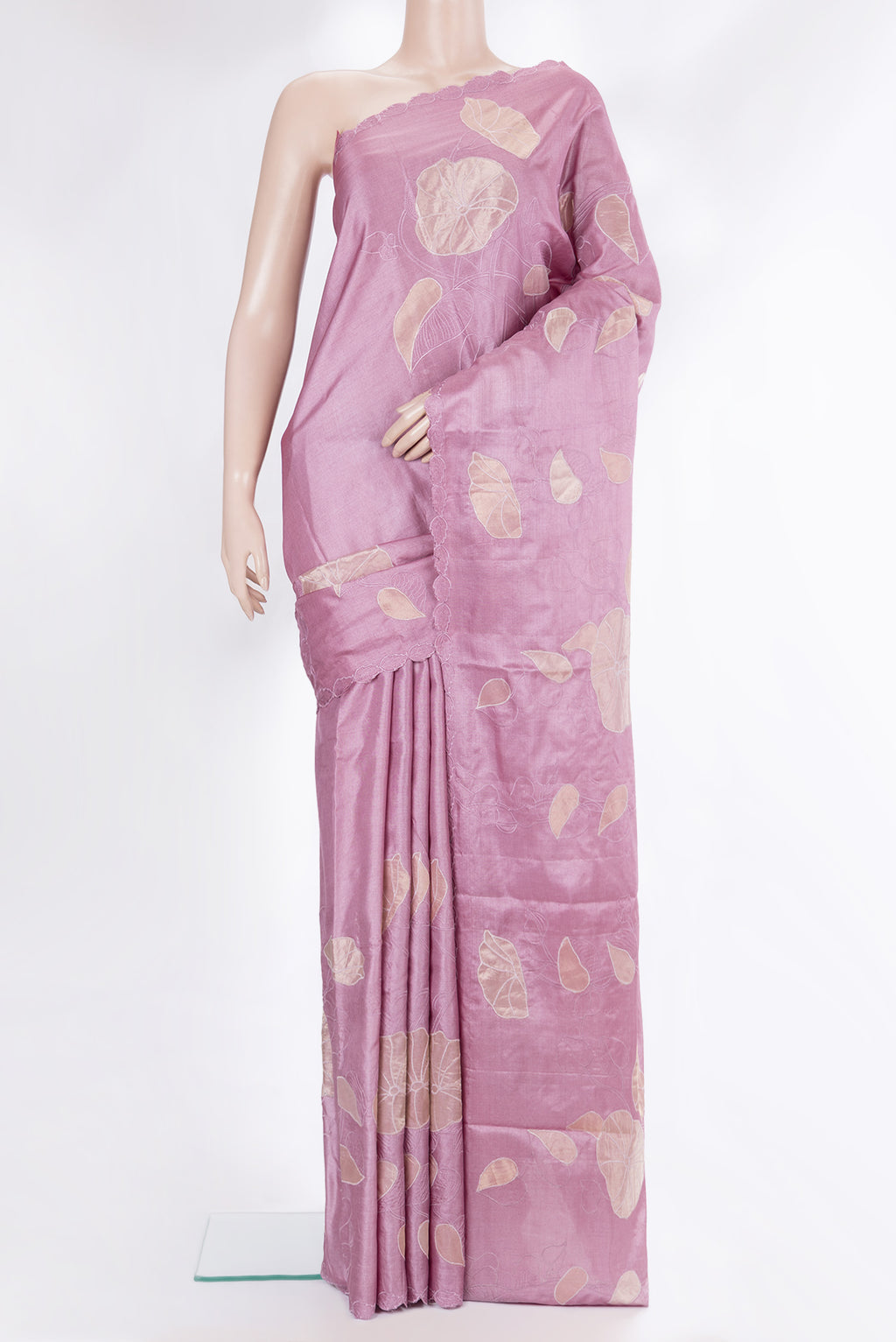 Rose Gold Tussar Saree with Embroidery on the body and Embroidery Border.  displayed on a mannequin