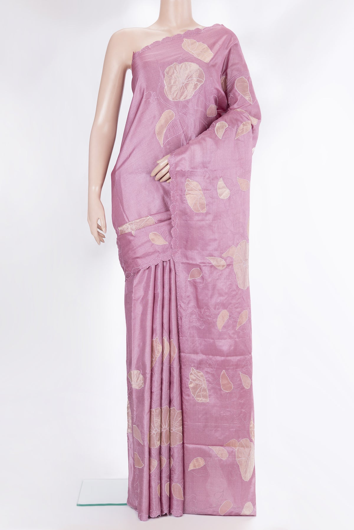 Rose Gold Tussar Saree with Embroidery on the body and Embroidery Border.  displayed on a mannequin