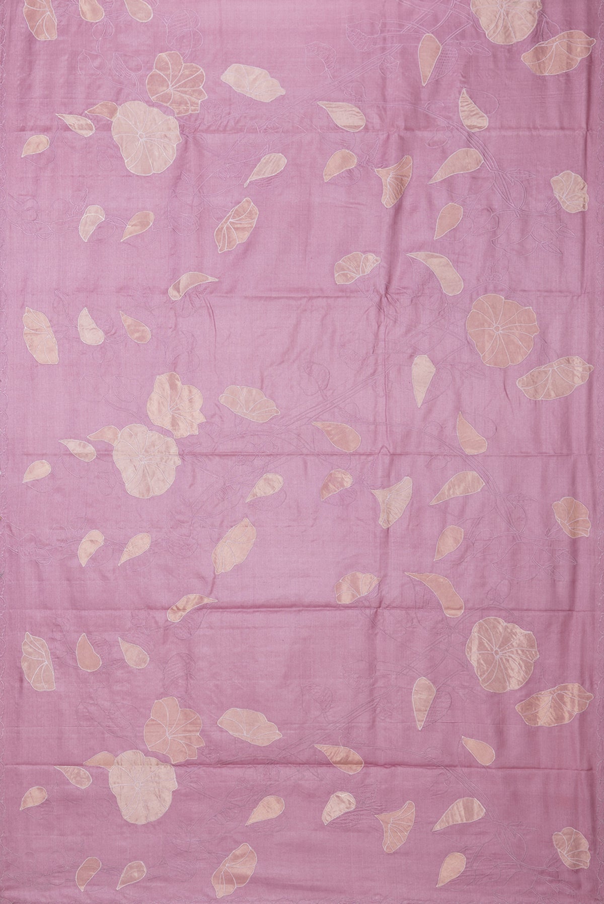 Flat view of Rose Gold Tussar Saree with Embroidery on the body and Embroidery Border. 