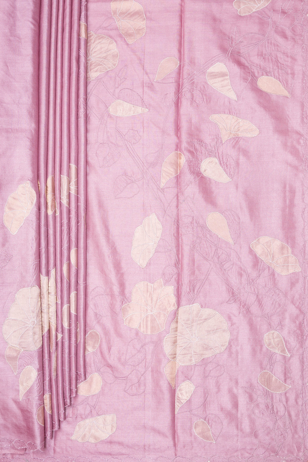 Pleats and pallu of Rose Gold Tussar Saree with Embroidery on the body and Embroidery Border. 