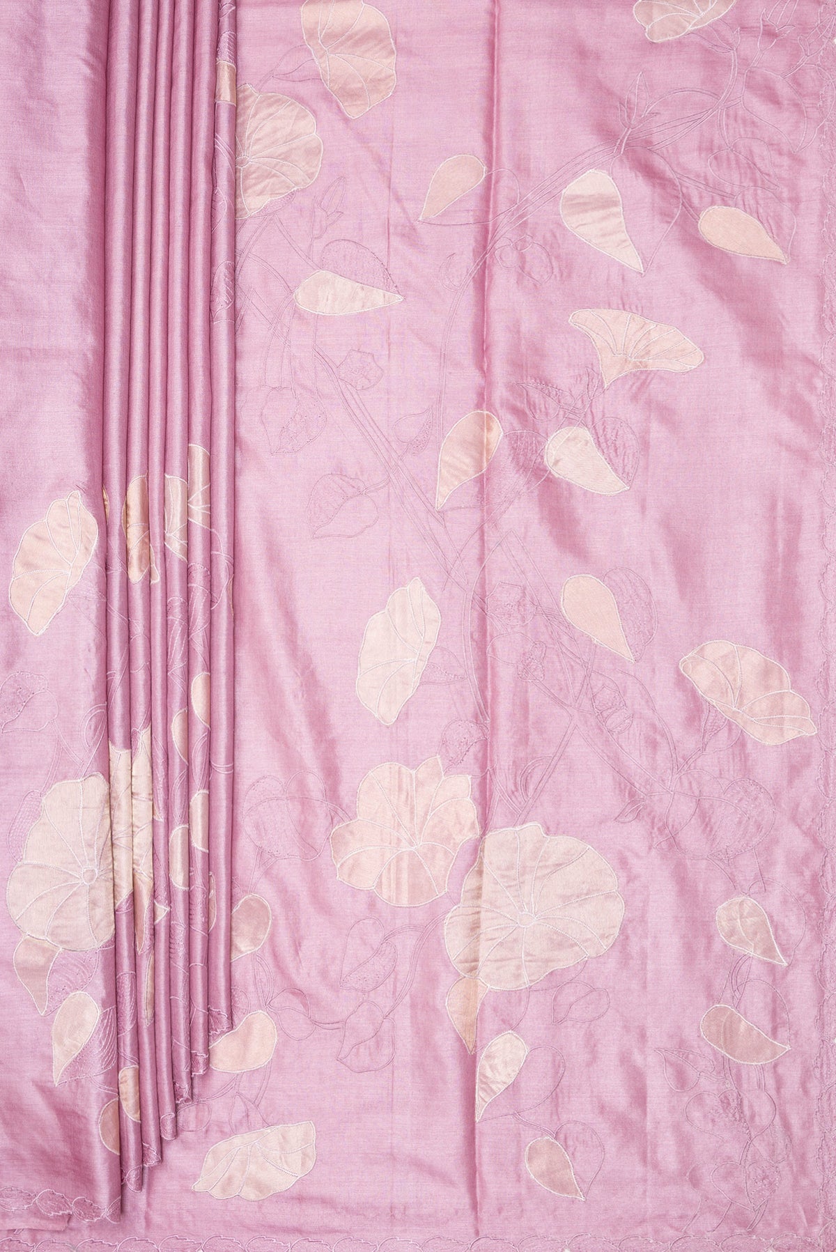 Pleats and pallu of Rose Gold Tussar Saree with Embroidery on the body and Embroidery Border. 