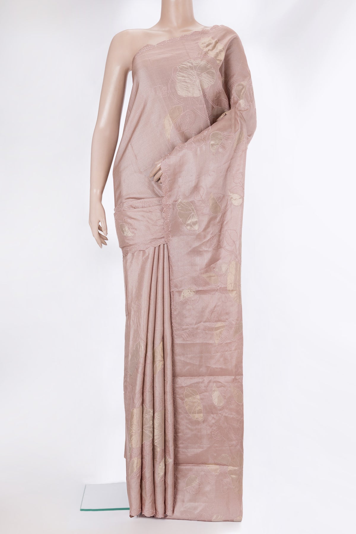 Rose Gold Tussar Saree with Embroidery on the body and Embroidery Border.  displayed on a mannequin