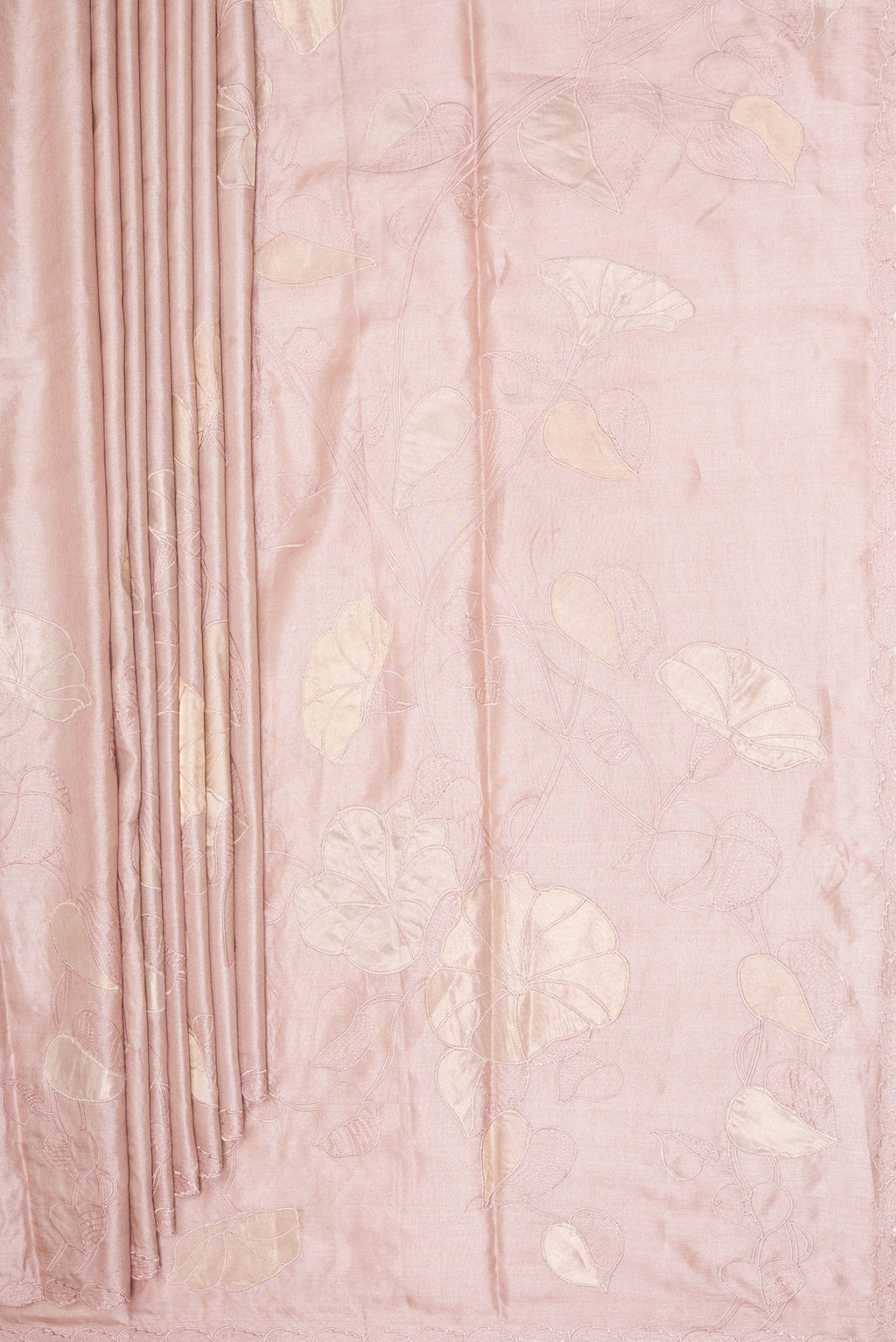 Pleats and pallu of Rose Gold Tussar Saree with Embroidery on the body and Embroidery Border. 